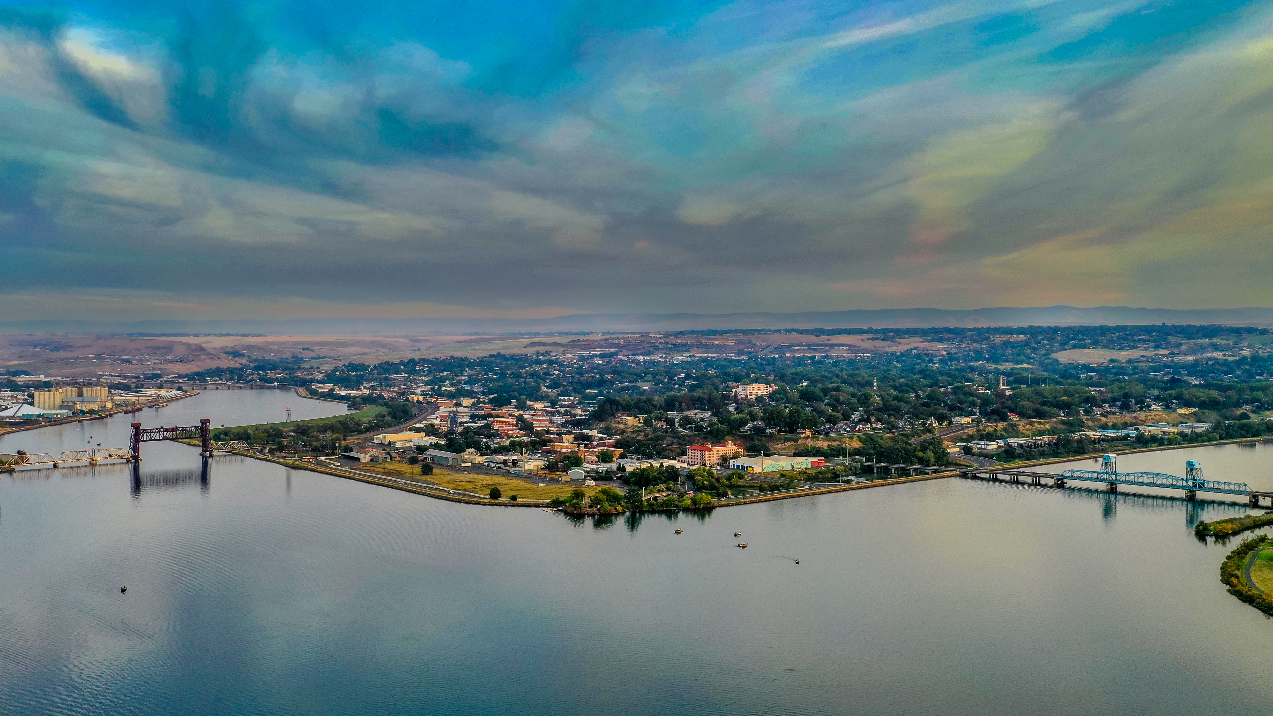 Panoramic twilight view of Lewiston with bridges spanning the confluence